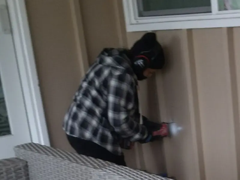 Professional electrician installing an exterior outlet in Groesbeck